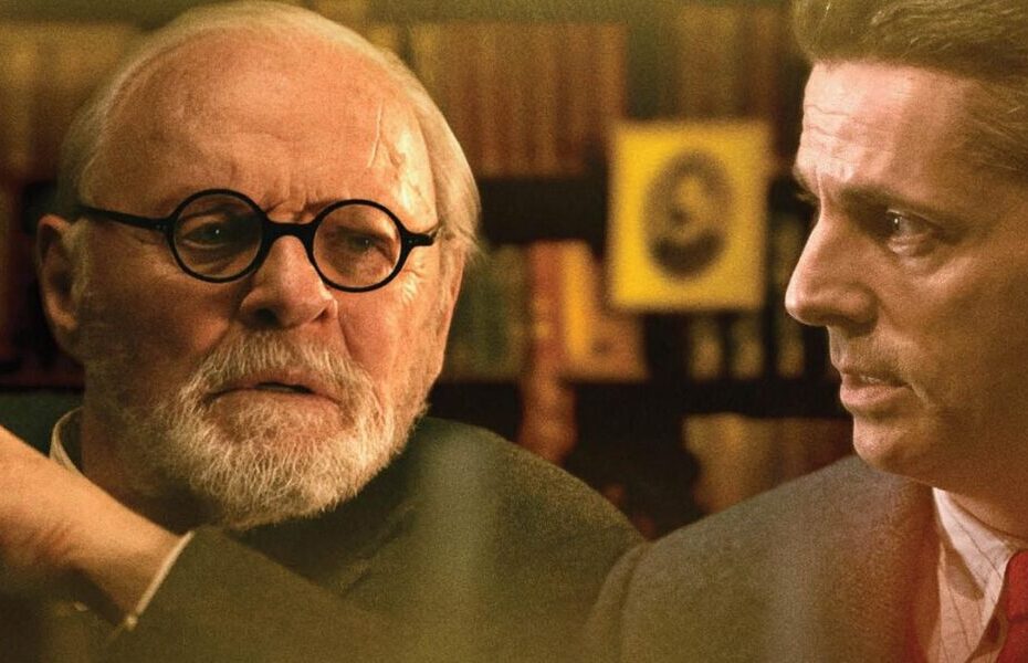 Freud's Last Session é um filme fascinante que retrata um debate sobre a existência de Deus entre Sigmund Freud e C.S. Lewis no período antes da Segunda Guerra Mundial. Adaptado da peça teatral de Mark St. Germain, o filme acompanha Freud, que está terminalmente doente devido ao câncer bucal, em um acalorado duelo filosófico com um acadêmico cristão sobre a existência e natureza de Deus. Através desse embate perspicaz, somos levados a uma compreensão mais profunda de ambos os homens, enquanto flashbacks revelam seus passados problemáticos. Uma subtrama paralela aborda a sexualidade reprimida da filha de Freud e seu comportamento obsessivo ao cuidar dele. Este é material instigante, destinado a um público que aprecia discussões sofisticadas protagonizadas por atores excelentes. Agora, vamos explorar mais detalhes sobre essa obra intrigante. "Diálogo Fascinante Sobre a Mortalidade: Uma Análise de Freud's Last Session"