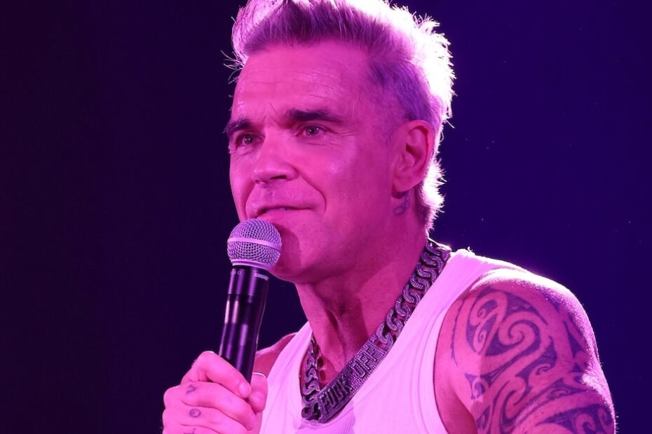 Robbie Williams lança "Forbidden Road" e anuncia biopic e tour